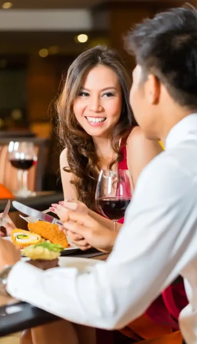 touchoftuscany-date-night-italian-restaurant-hurricane-utah Couple sharing a romantic dinner with wine at Touch of Tuscany Italian Steakhouse in Hurricane, Utah.