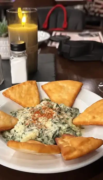 spinach-artichoke-dip-appetizer-italian-restaurant-hurricane-utah Spinach artichoke dip appetizer served with bread at Touch of Tuscany Italian restaurant in Hurricane Utah