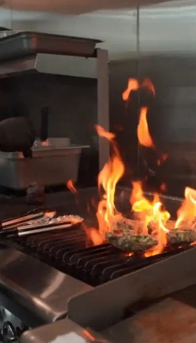 steak-grill-cooking-italian-steakhouse-kitchen-hurricane-utah Steak grilling in the kitchen at Touch of Tuscany Italian steakhouse in Hurricane Utah