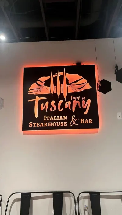touch-of-tuscany-italian-steakhouse-sign-hurricane-utah Touch of Tuscany Italian Steakhouse and Bar restaurant sign inside the Hurricane Utah dining room near Zion National Park